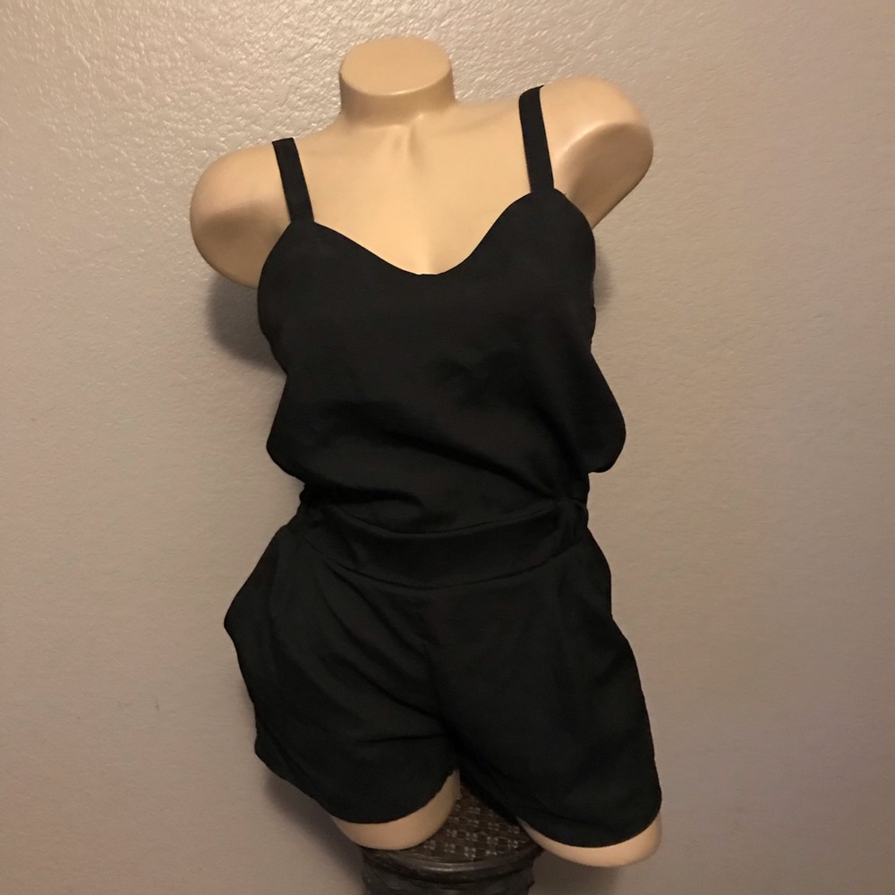Black romper small with pockets criss cross back